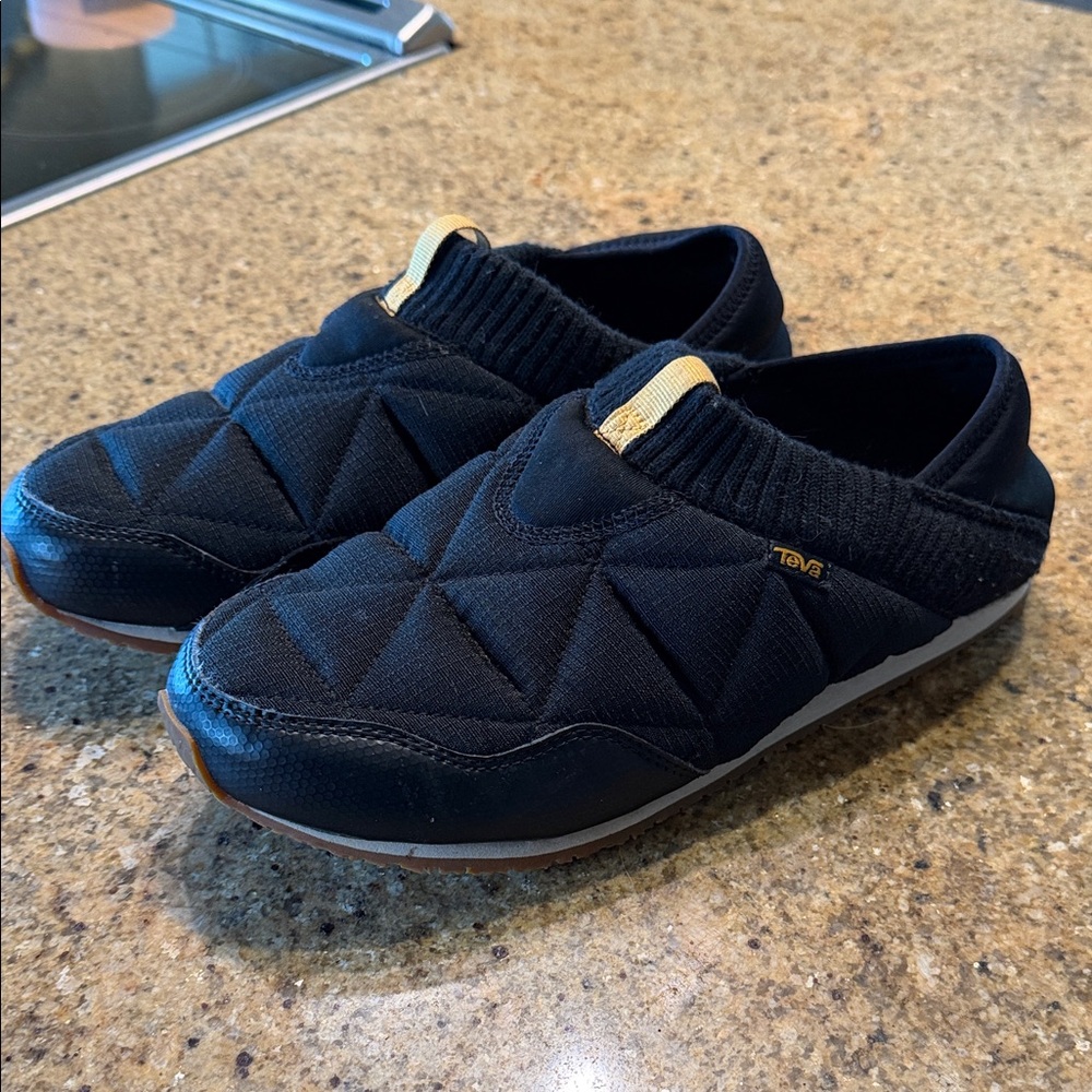Teva Black Quilted Slip-Ons with Gold Detail